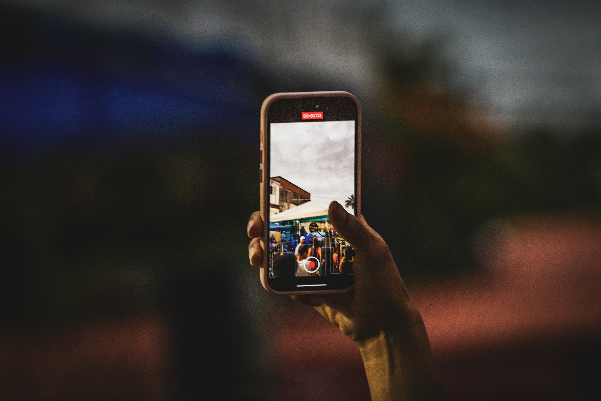 A hiker sharing photos on a phone
