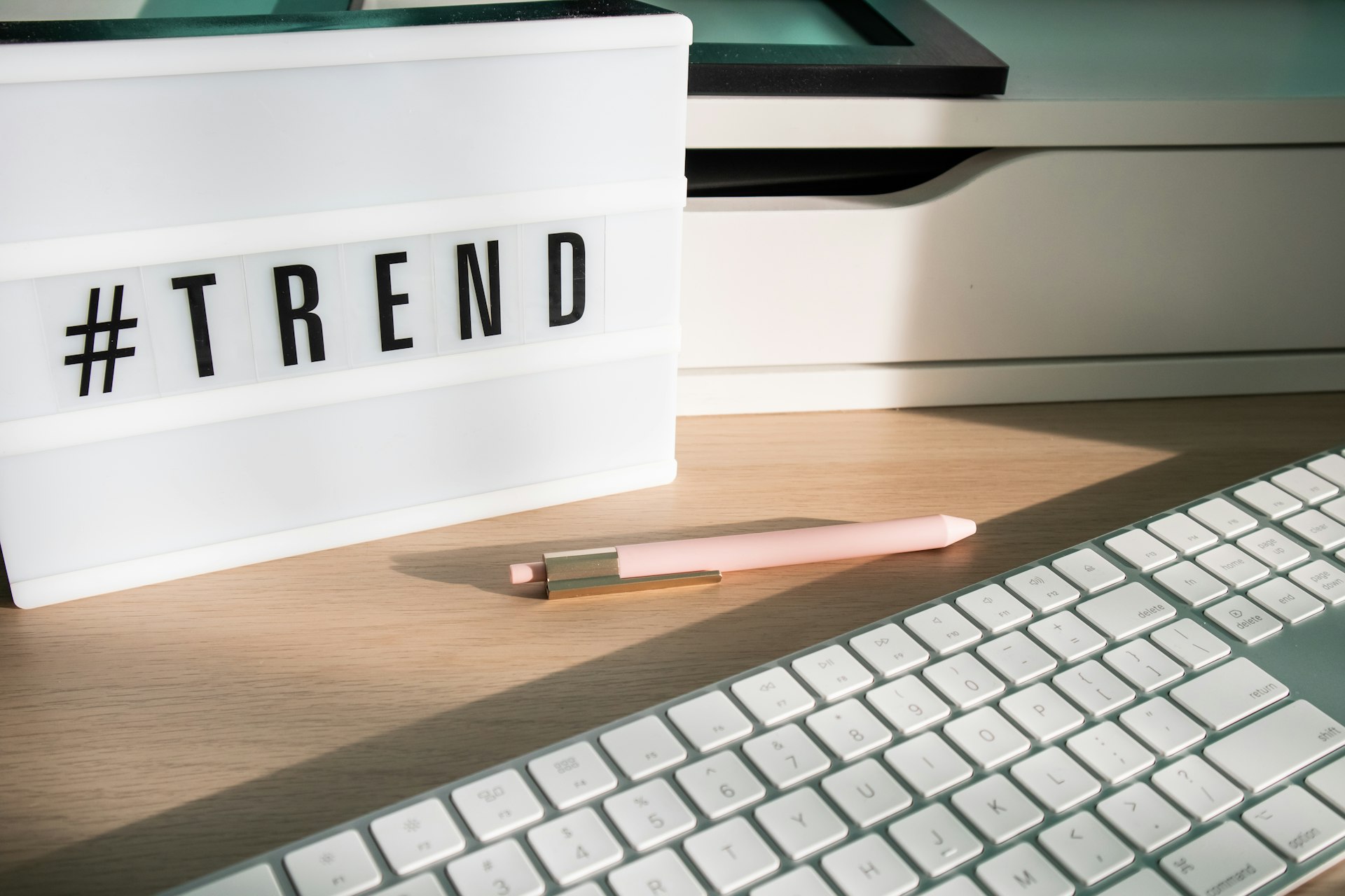 A keyword volume spreadsheet beside a trends chart