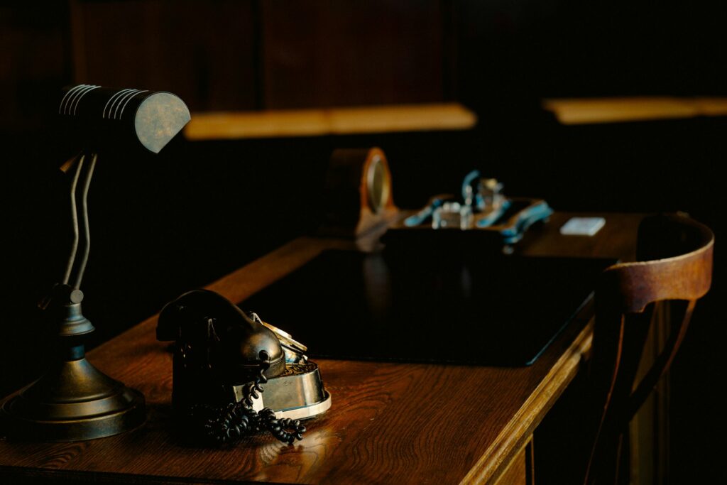 An auction gavel on a wooden desk