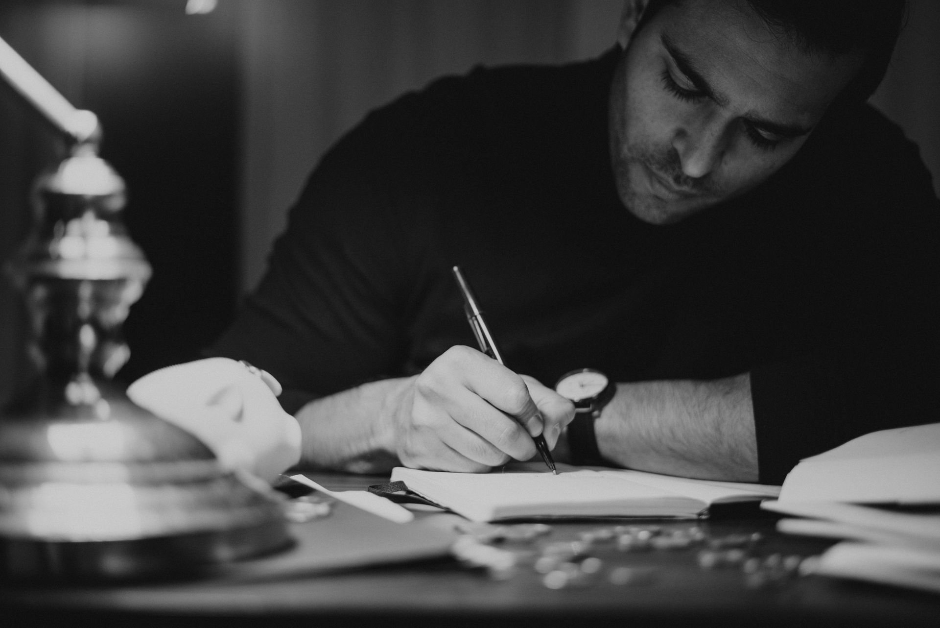 A writer at a desk with a notebook