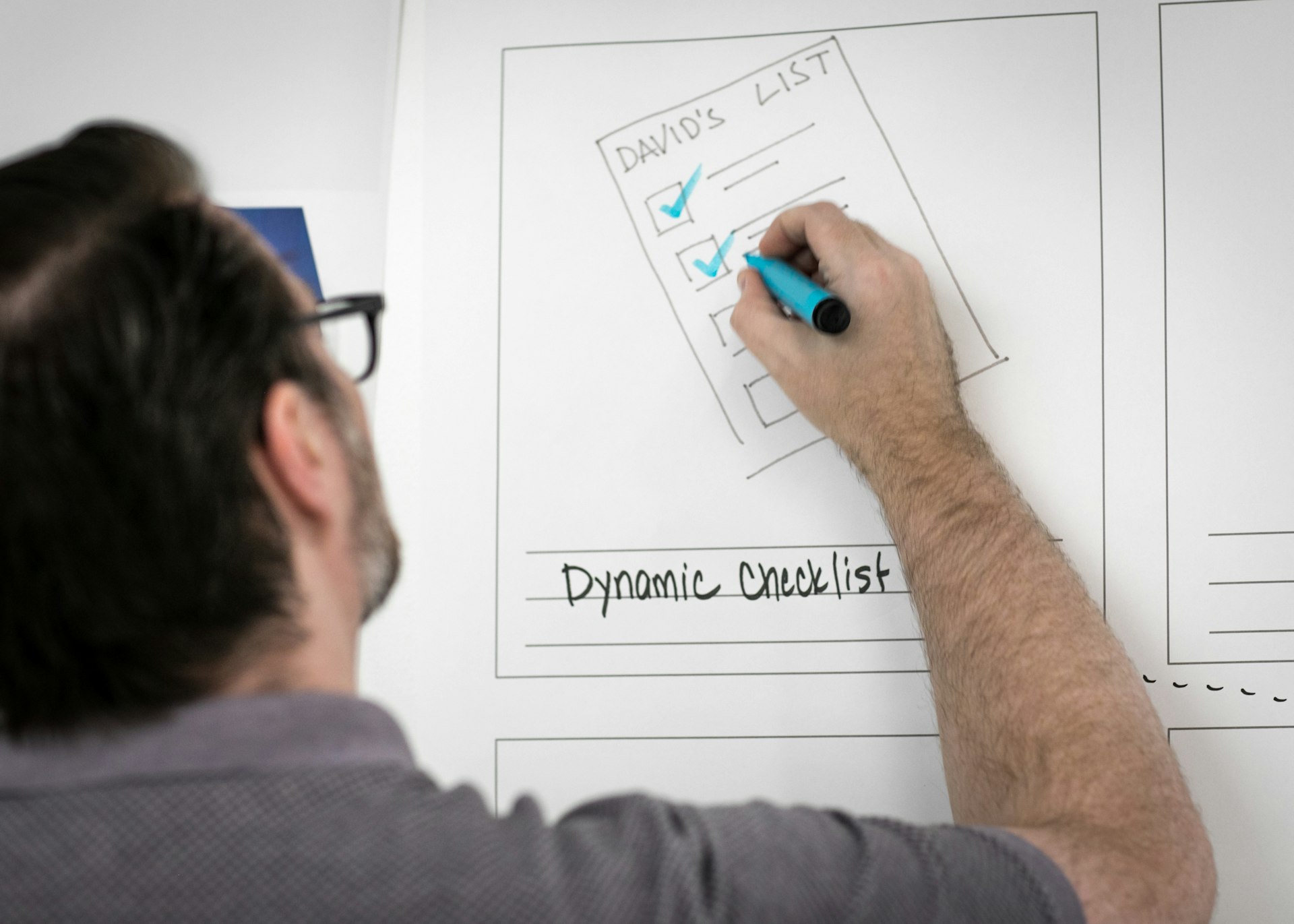 A researcher noting findings in a spreadsheet