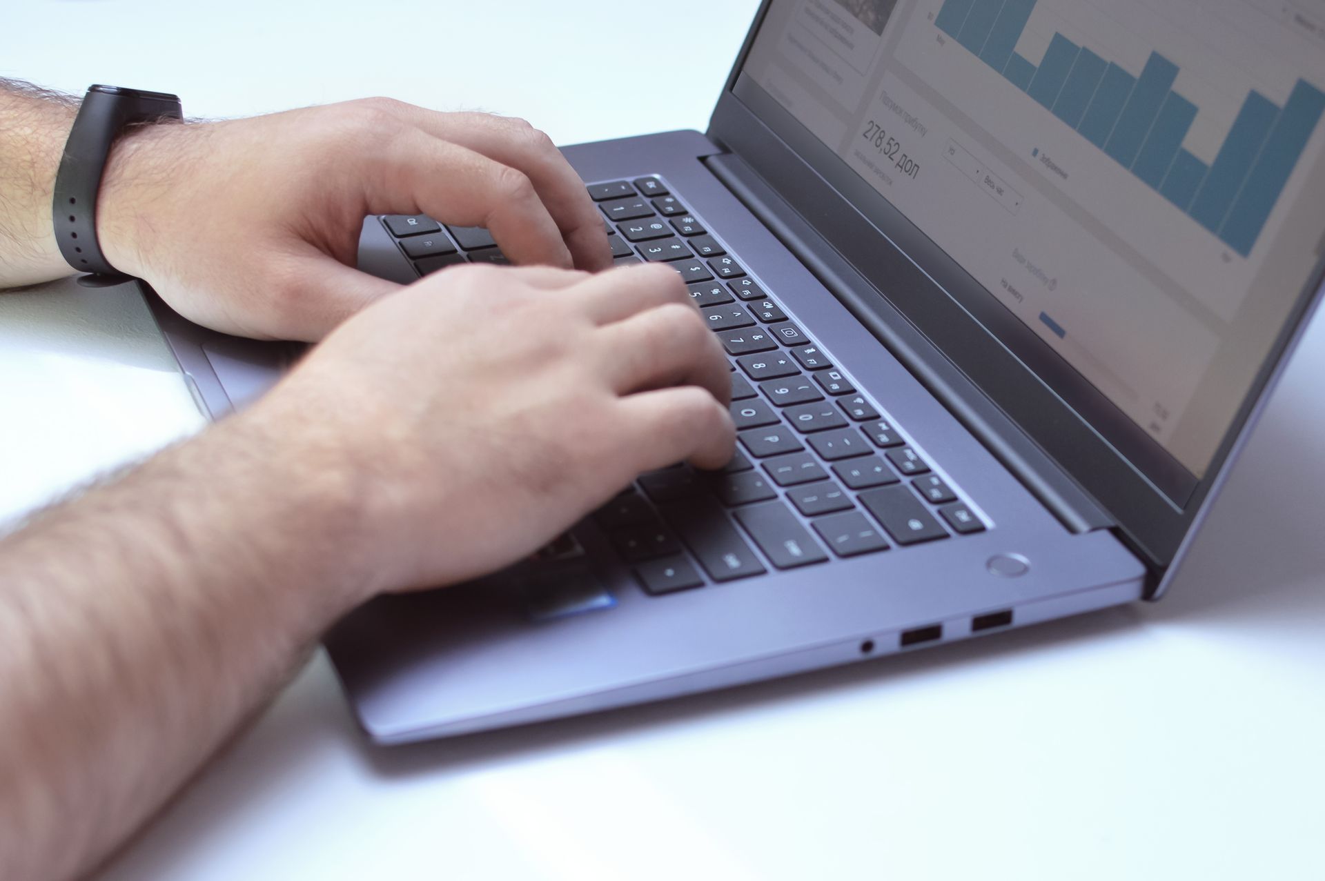 A laptop showing a website traffic chart