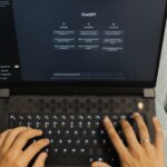 A chatbot search answer with source links on a laptop