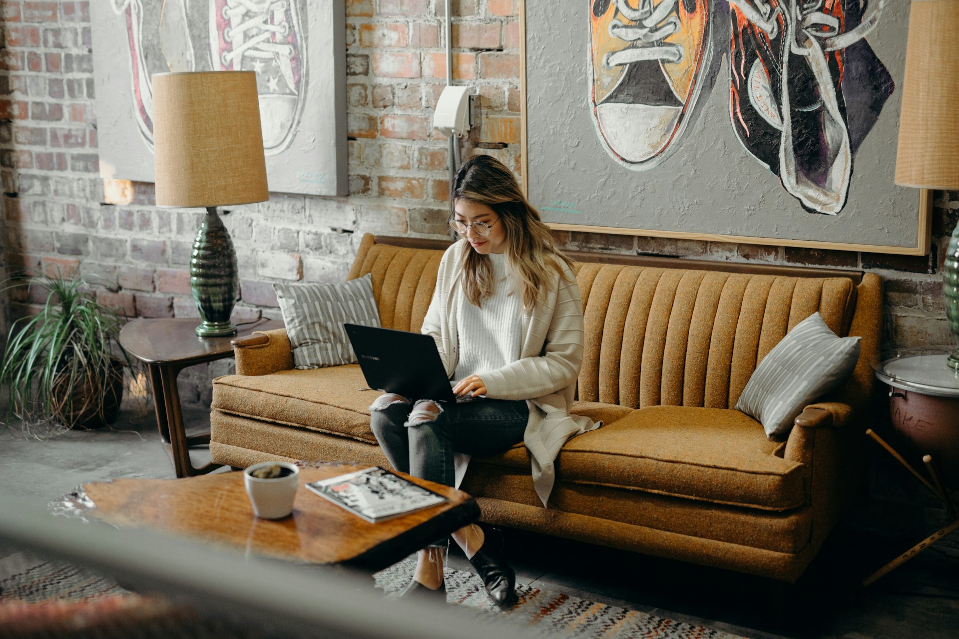 A woman reading a laptop screen