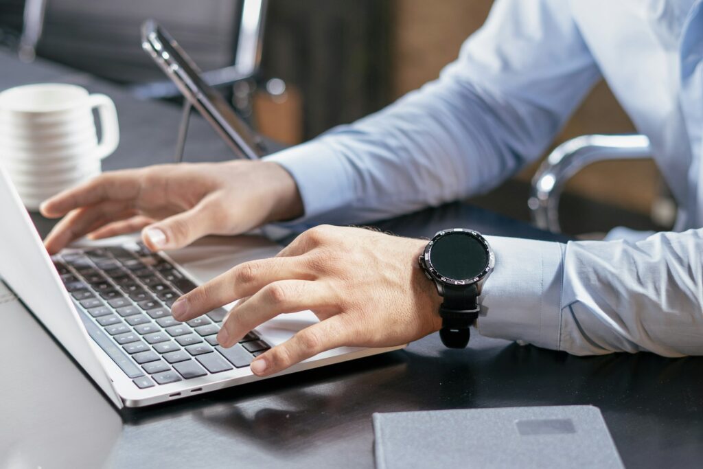 A person filling in a form on a laptop