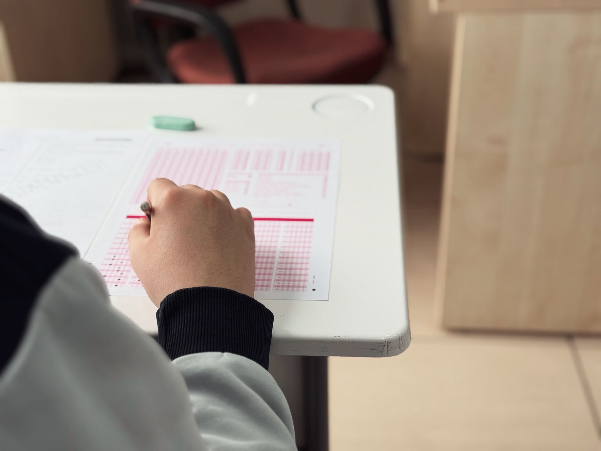 Hands testing a product at a desk