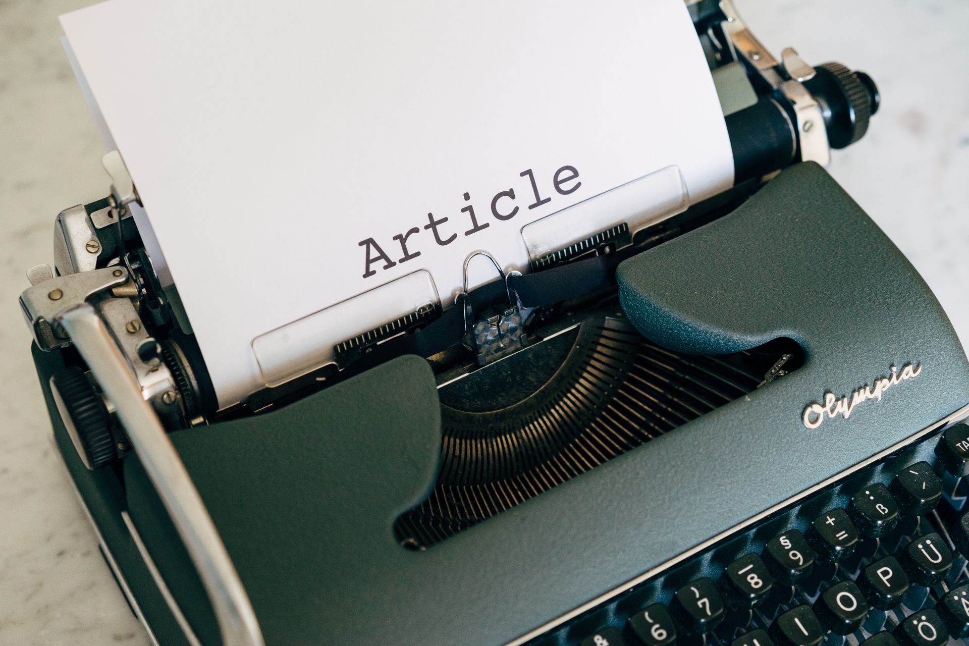 An editor merging two articles in a CMS
