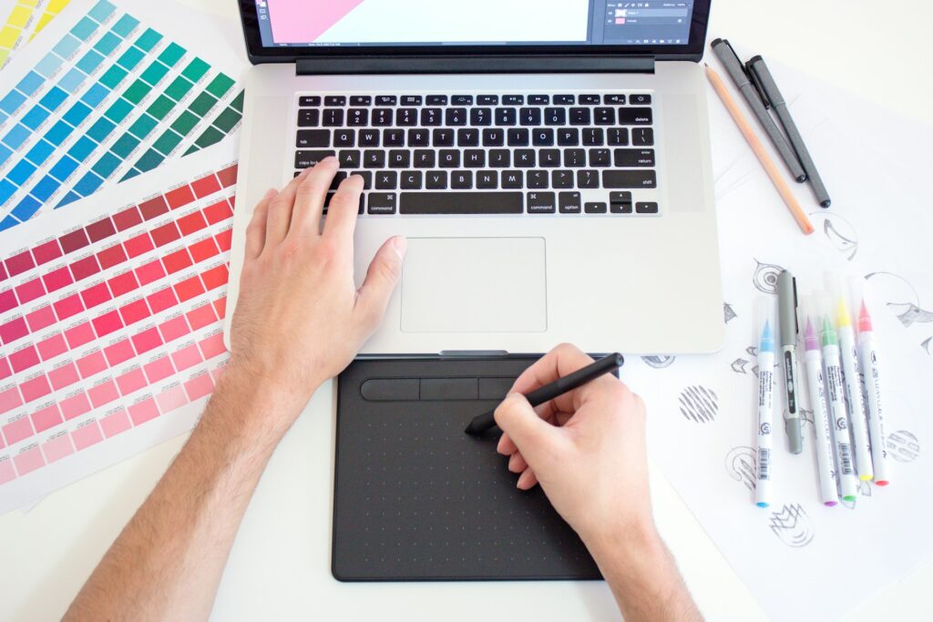 A designer sketching a page layout