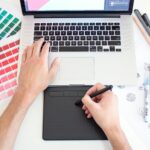 A designer sketching a page layout
