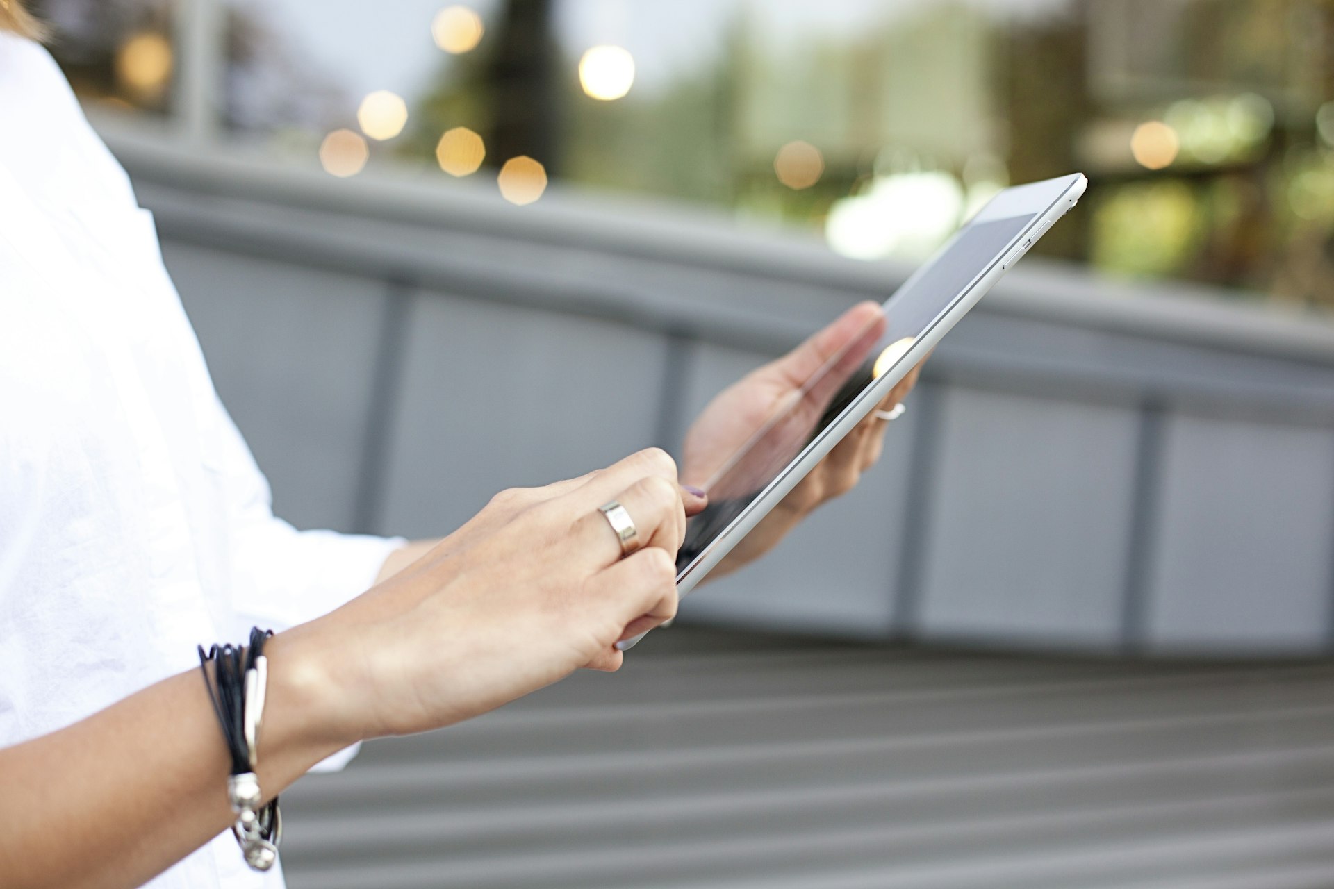 A person reading on a tablet