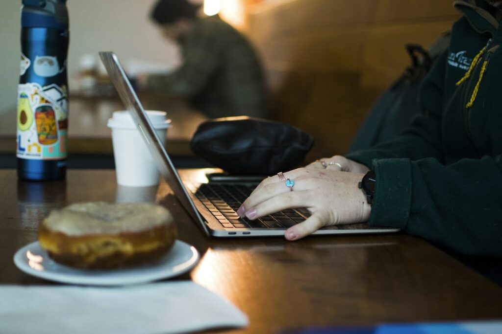 A professional writing at a cafe