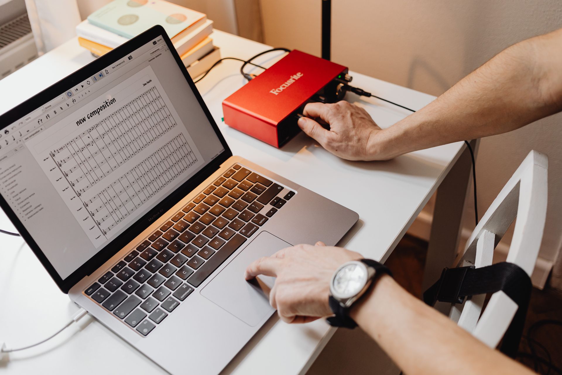 A person updating records on a laptop