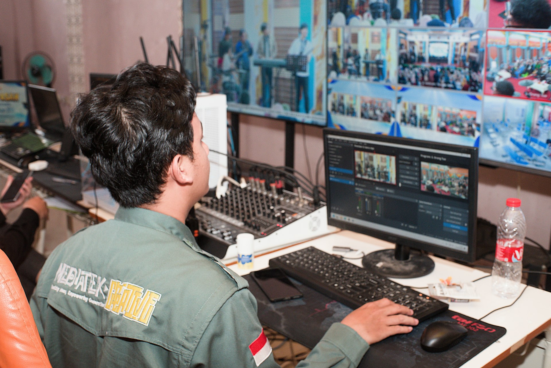 A security professional at a monitor