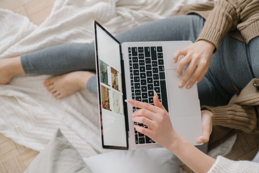A user clicking a search result on a laptop
