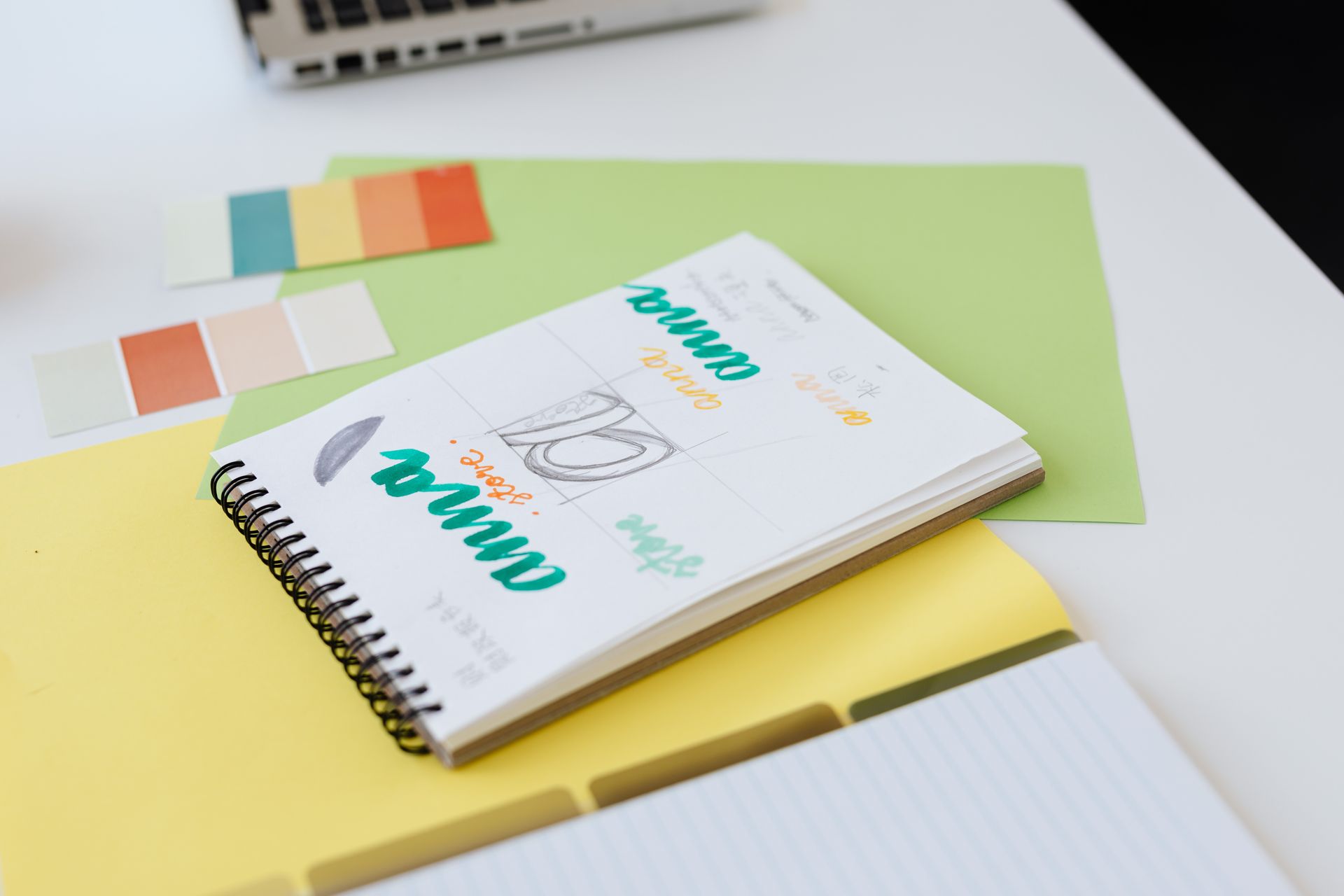Brand name sketches in a notebook