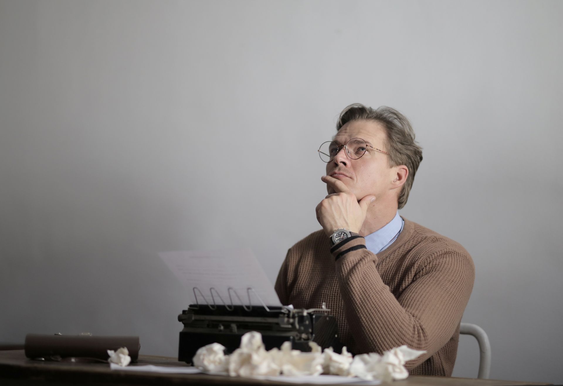 A writer drafting an issue at a desk