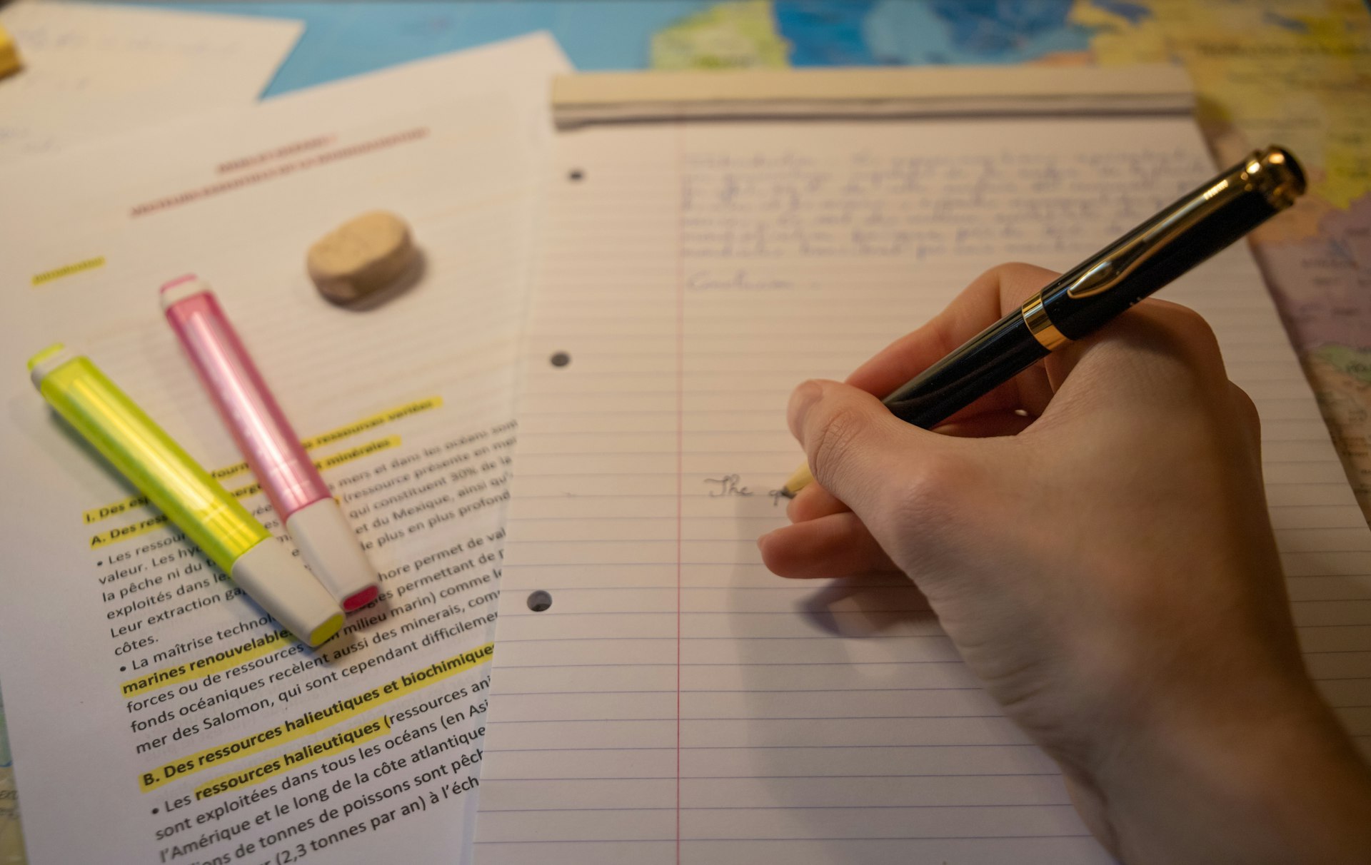 An editor outlining subtopics on a notepad