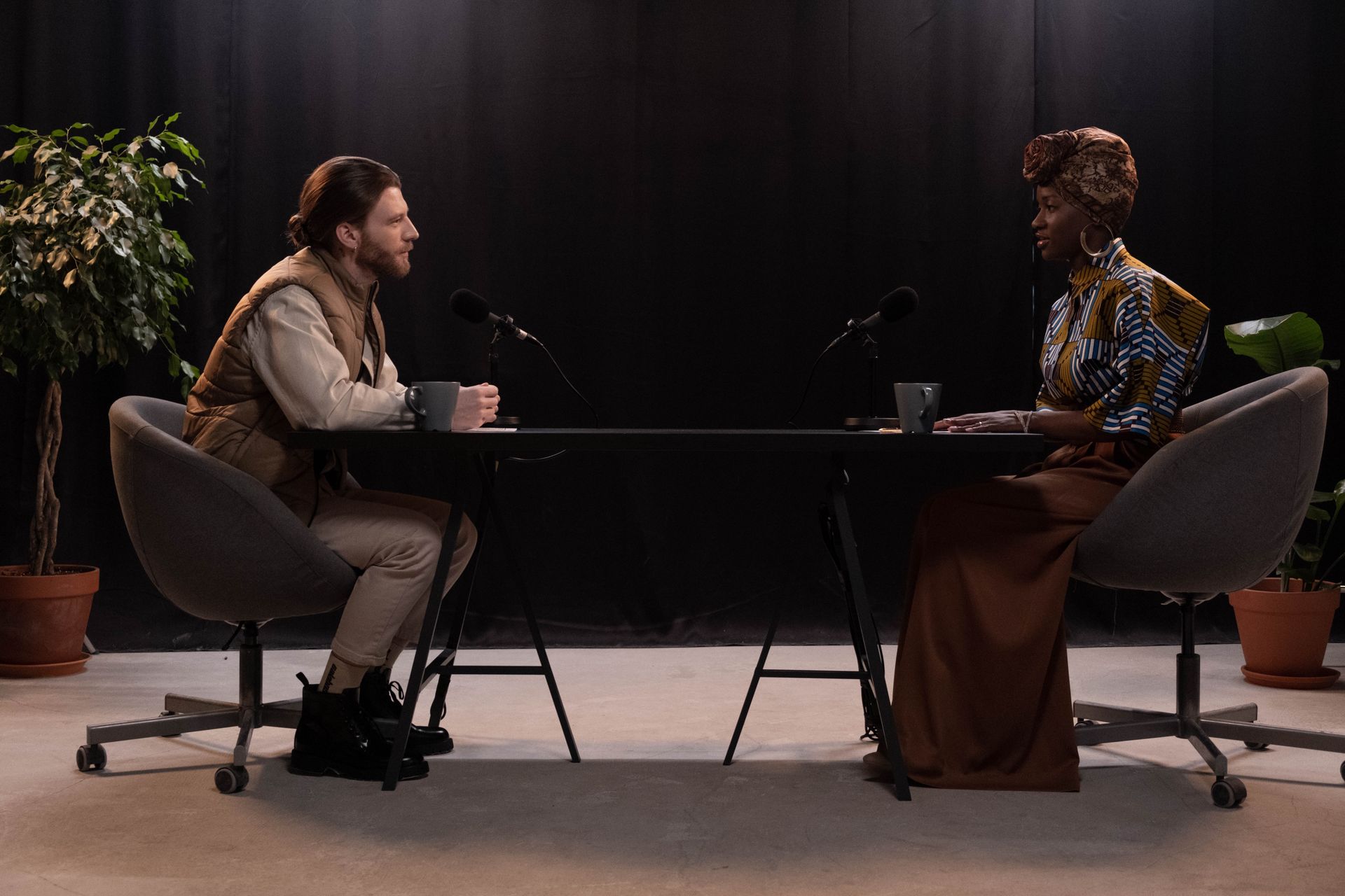 Two people recording a podcast