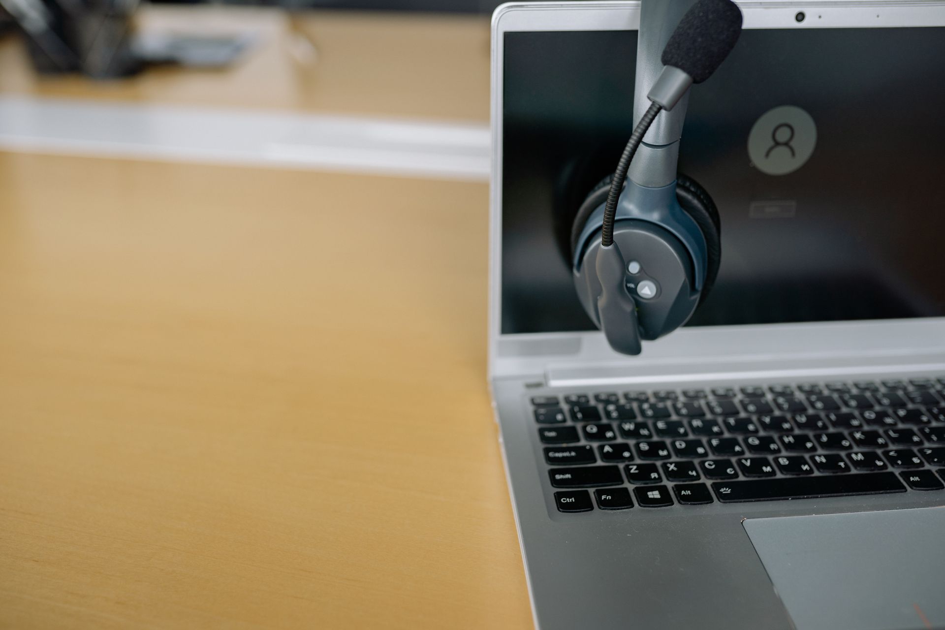 Headphones beside a laptop