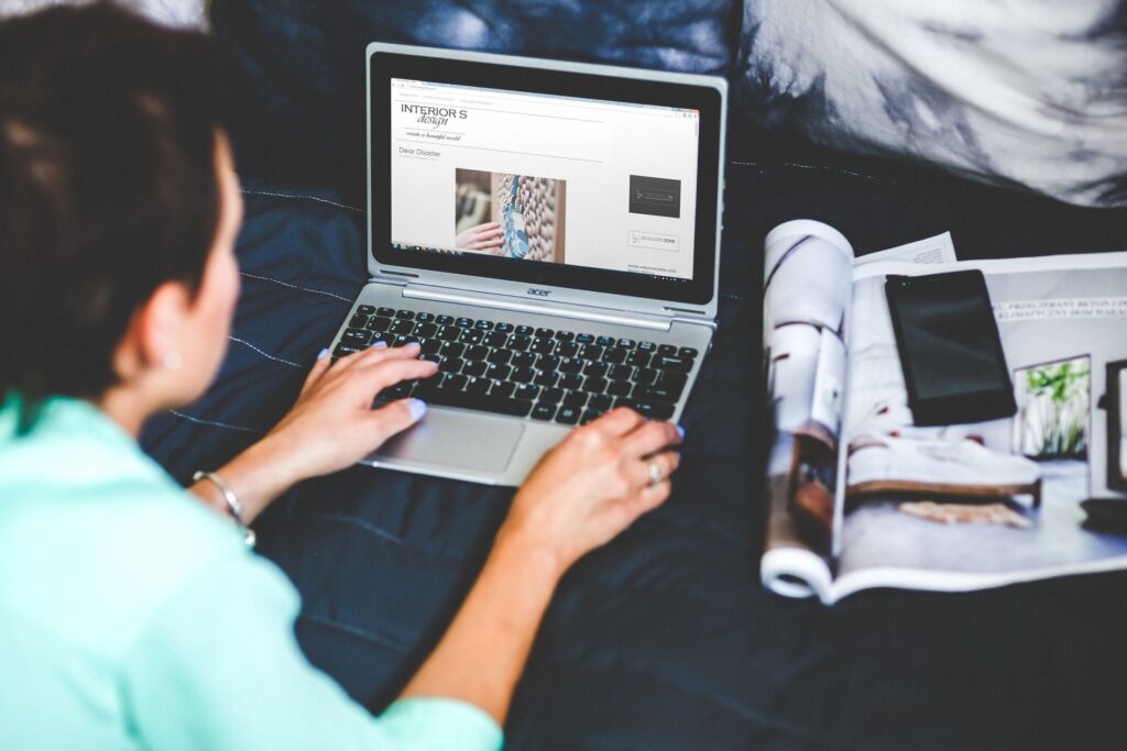 A travel blog with adverts open on a laptop
