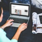 A travel blog with adverts open on a laptop