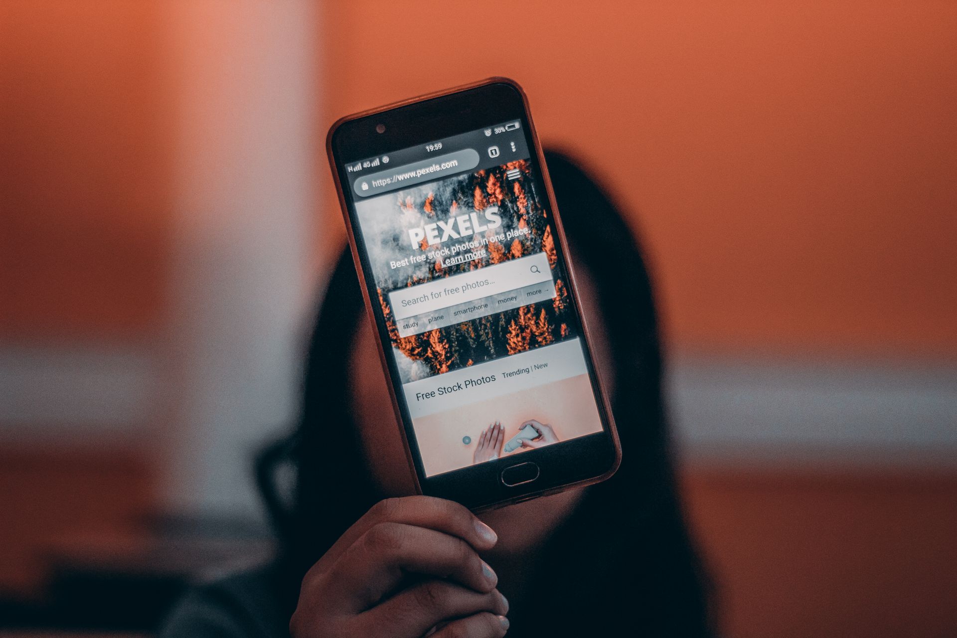 Person searching on smartphone