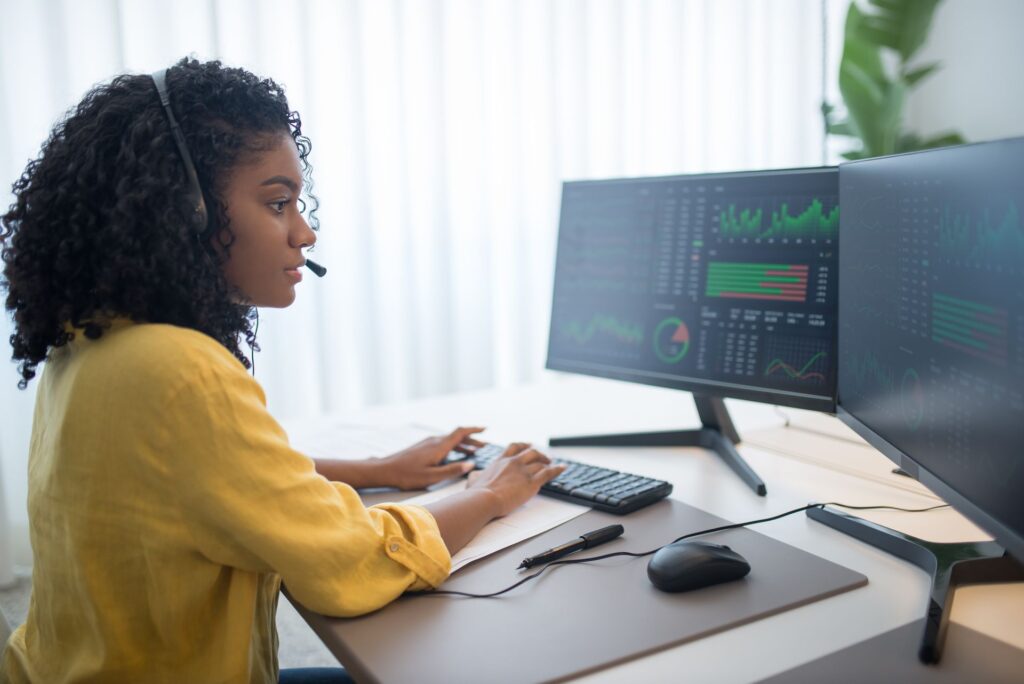 Two analytics dashboards on side-by-side monitors