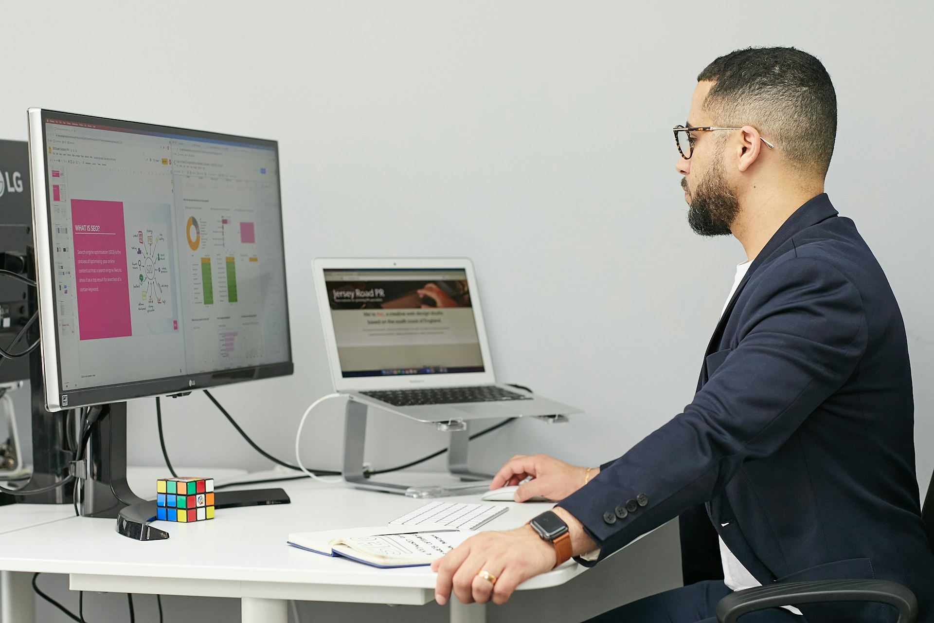 An analyst at two monitors