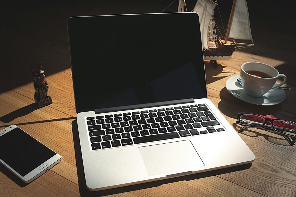 A laptop with a browser open on a desk