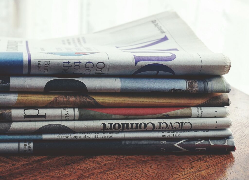Newspaper headlines on a table