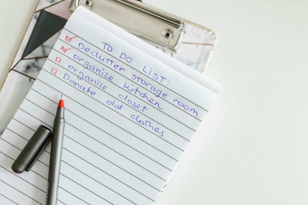 A checklist with items crossed out on a notepad