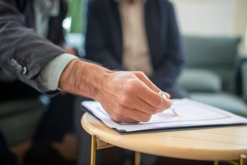 A proposal document on a desk with a pen