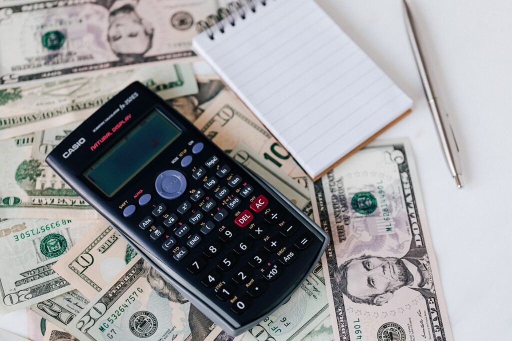 An ROI calculation on a calculator and notepad