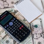 An ROI calculation on a calculator and notepad