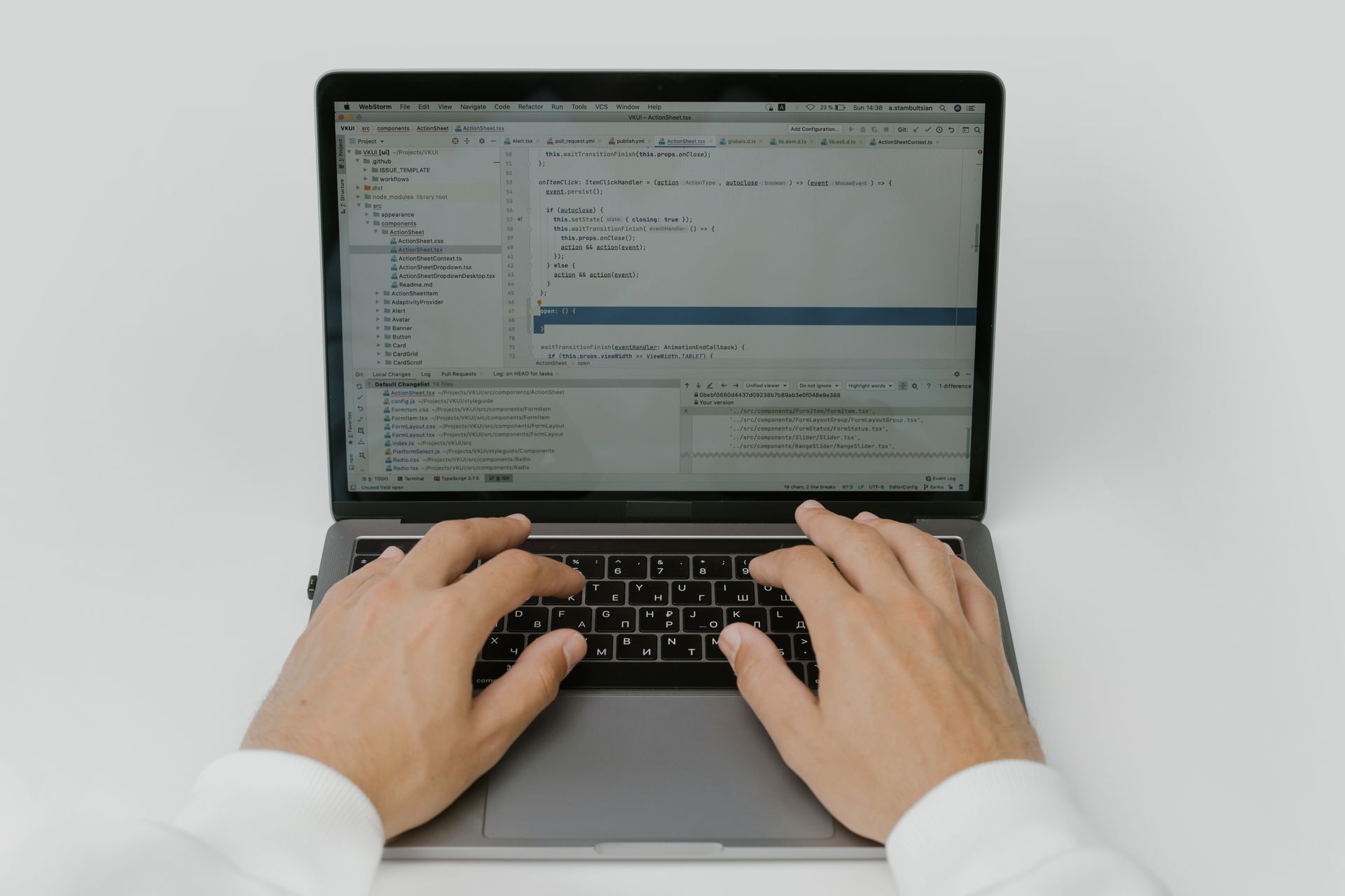 An editor shortening a headline on a laptop