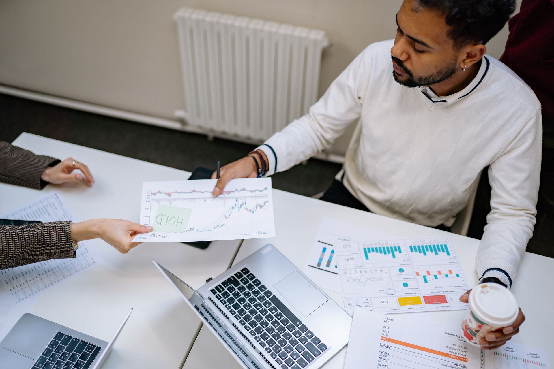 A marketer at a laptop with charts