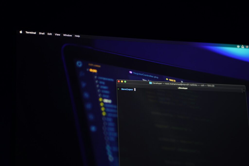 Code on a monitor in a dark office