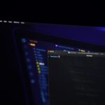 Code on a monitor in a dark office