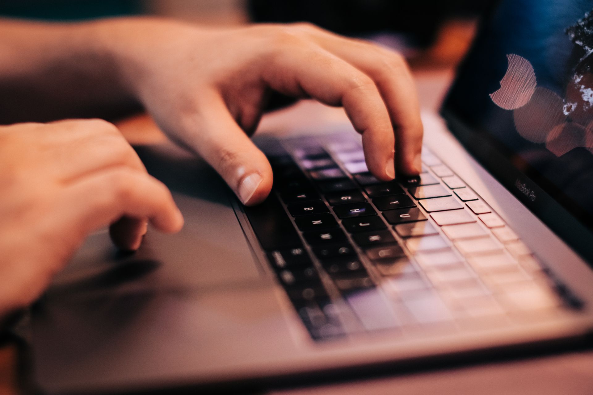 A person updating links on a laptop