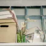Moving boxes and a plant in an office