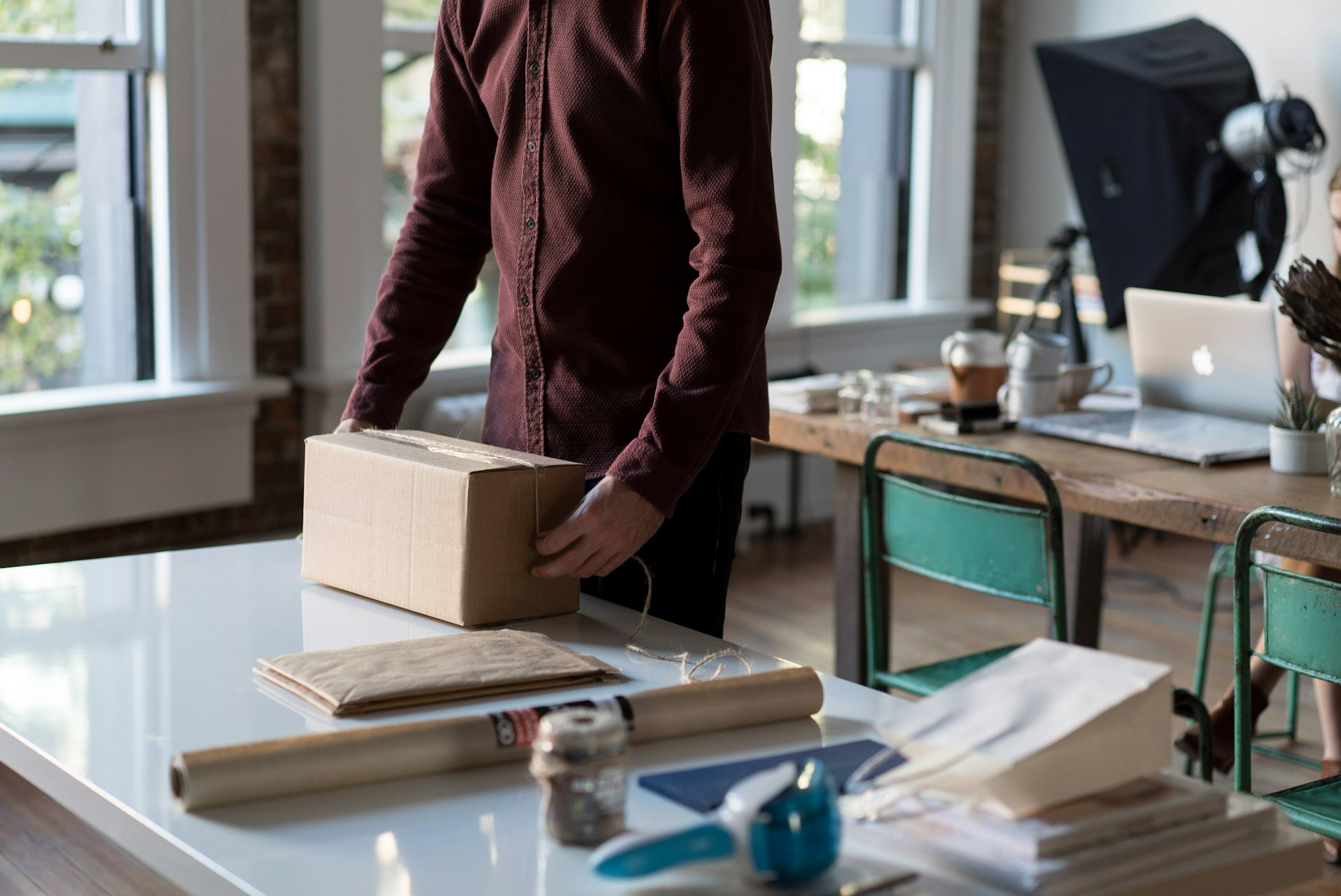 A store owner packing orders