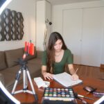 A blogger writing at a desk
