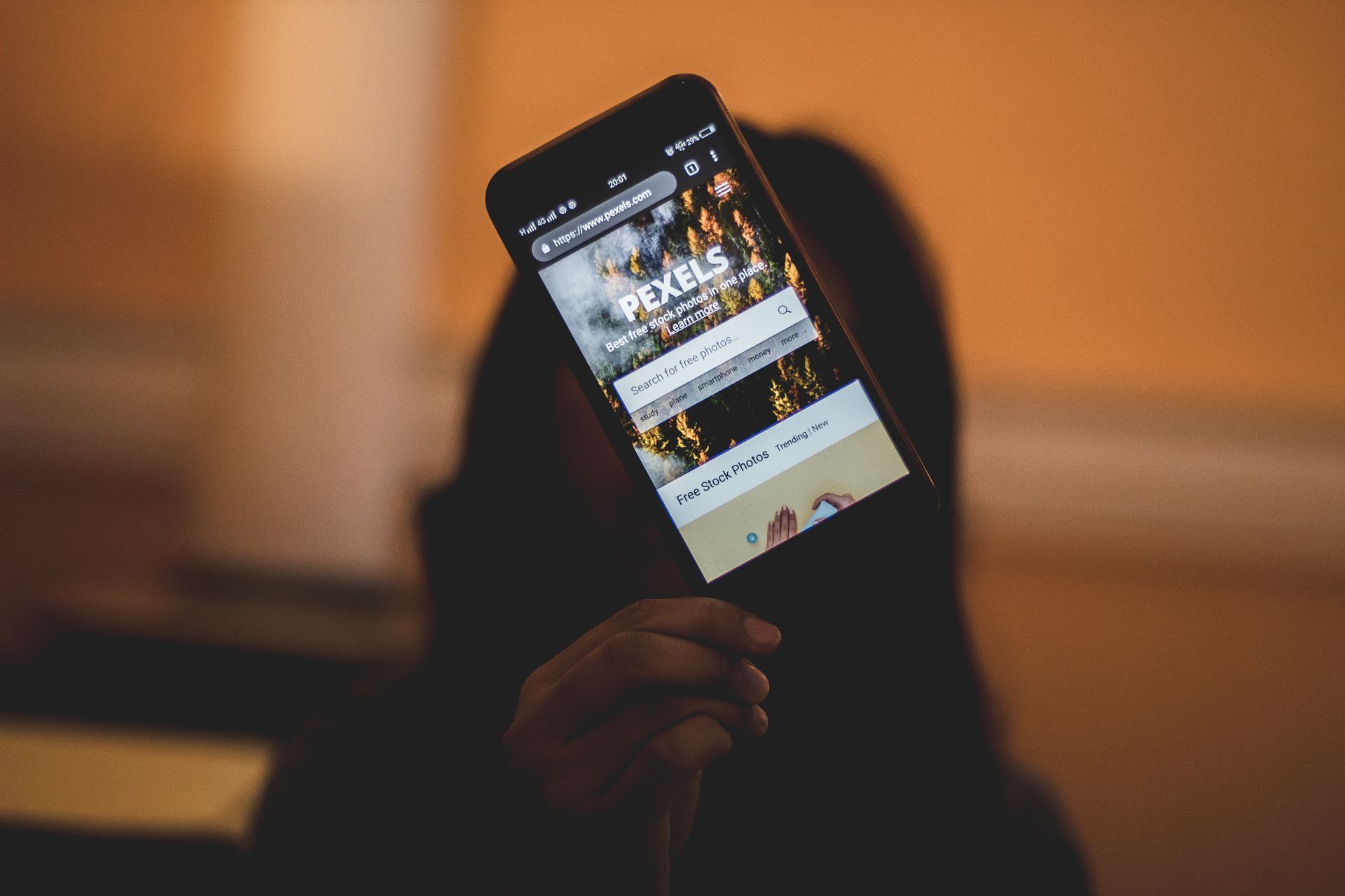 A phone showing a website