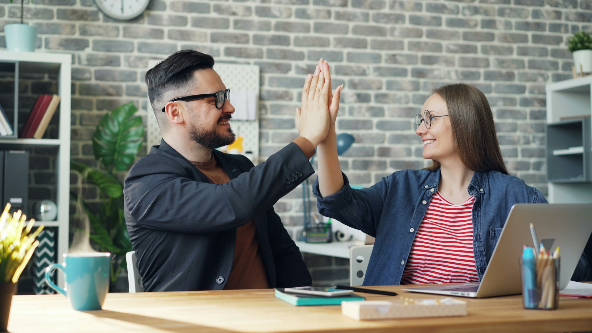 A handshake over a desk
