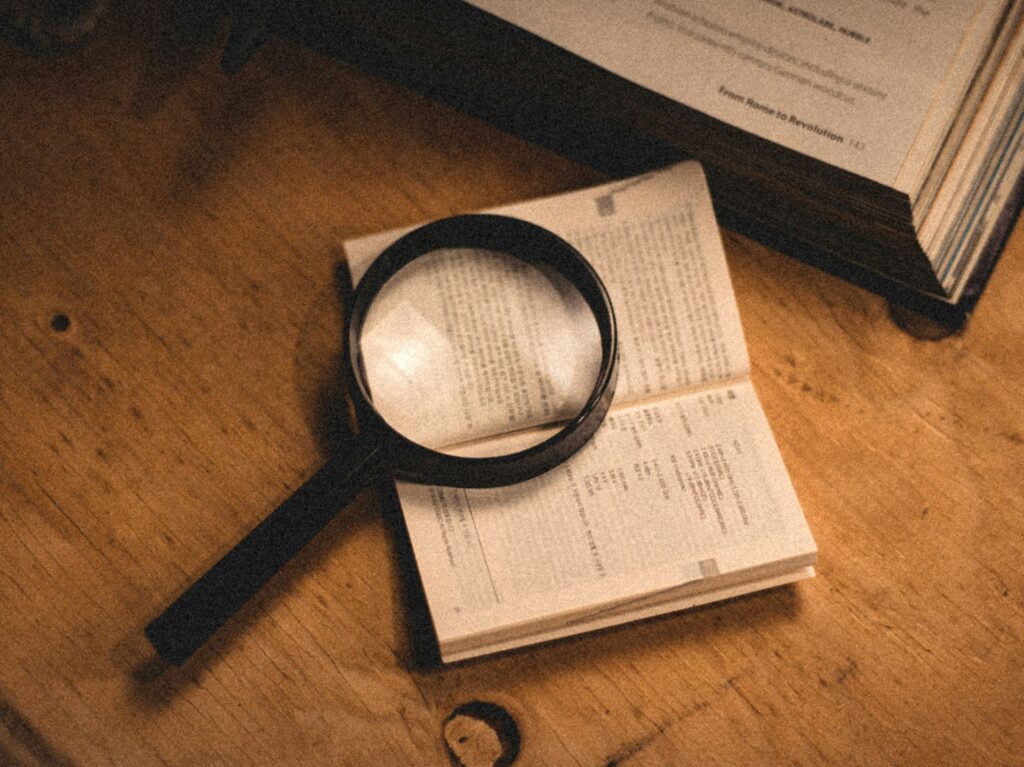 A magnifying glass over documents