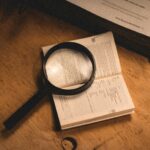 A magnifying glass over documents
