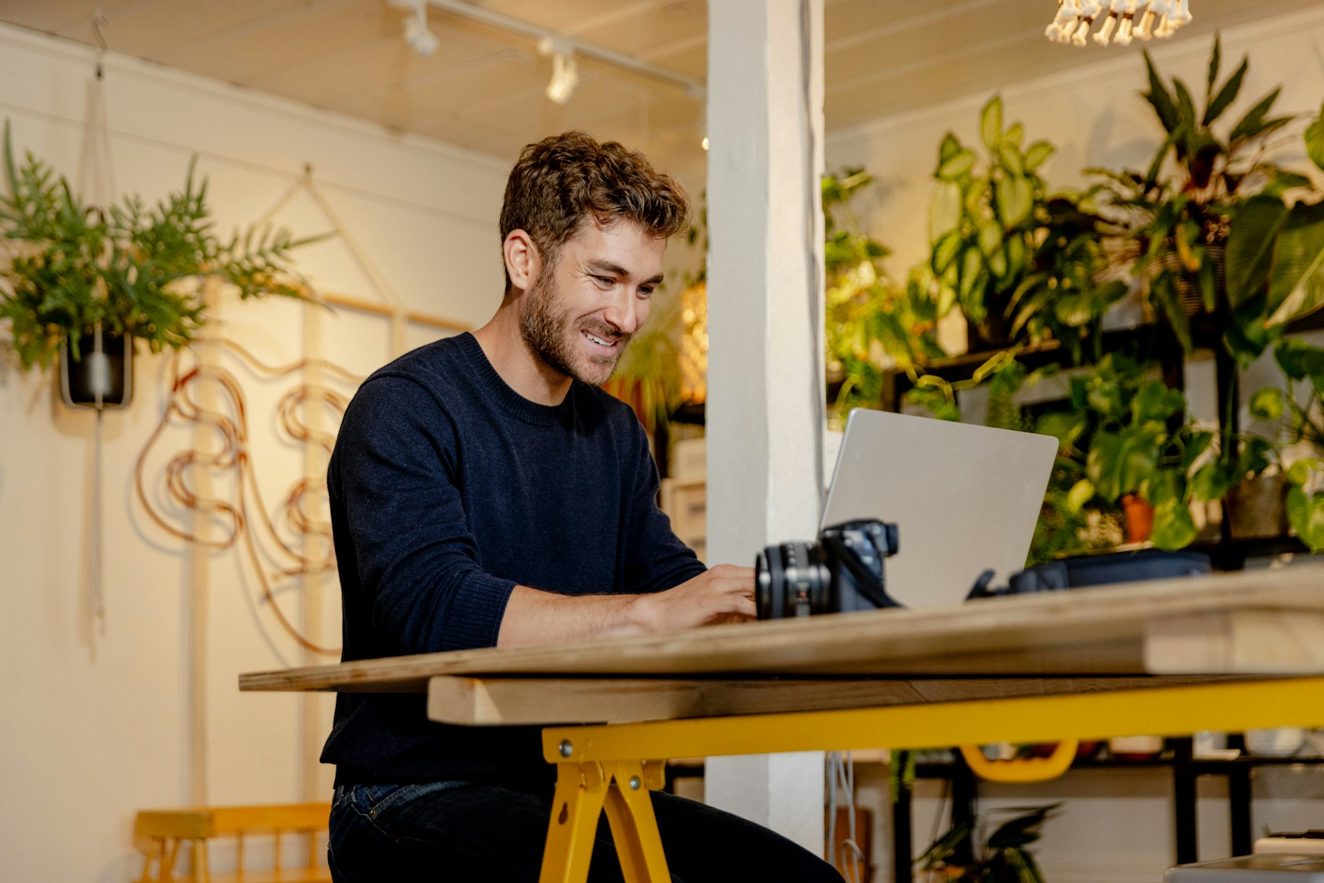 A shop owner at a laptop