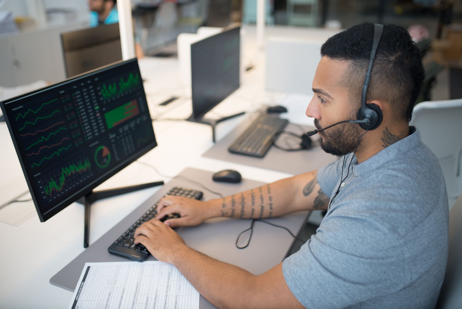 An analyst comparing search data on two monitors